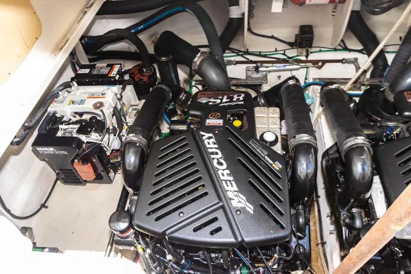 Slide: The Image of Engine compartment of a 2005 Sea Ray 340 Sundancer with Mercury engines. - 31