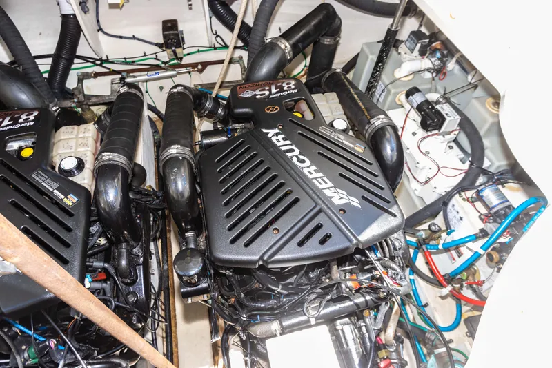 Slide: The Image of Engine compartment of a 2005 Sea Ray 340 Sundancer with twin Mercury engines. - 32