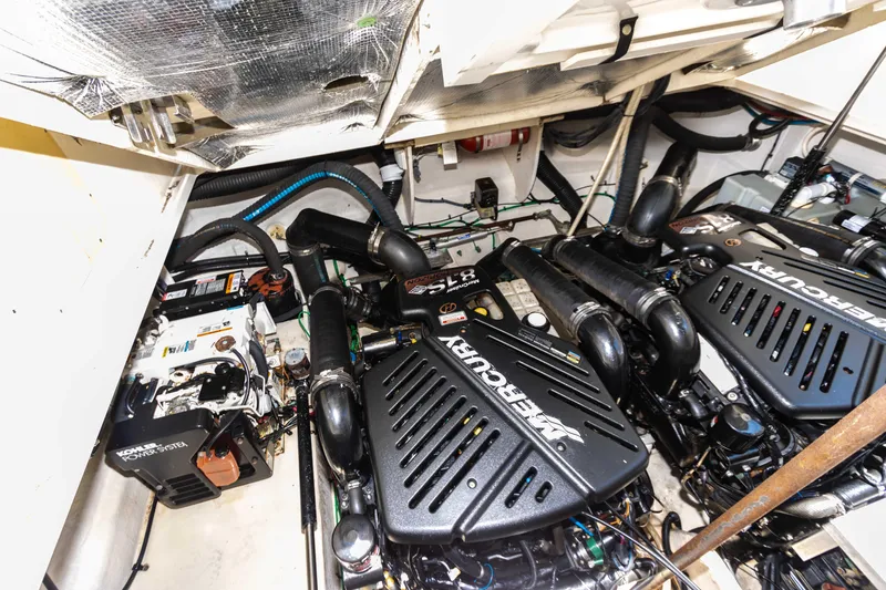 Slide: The Image of Engine room of a 2005 Sea Ray 340 Sundancer with twin Mercury engines. - 33