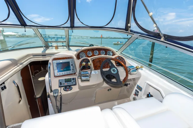 Slide: The Image of 2005 Sea Ray 340 Sundancer helm with navigation equipment and ocean view. - 34