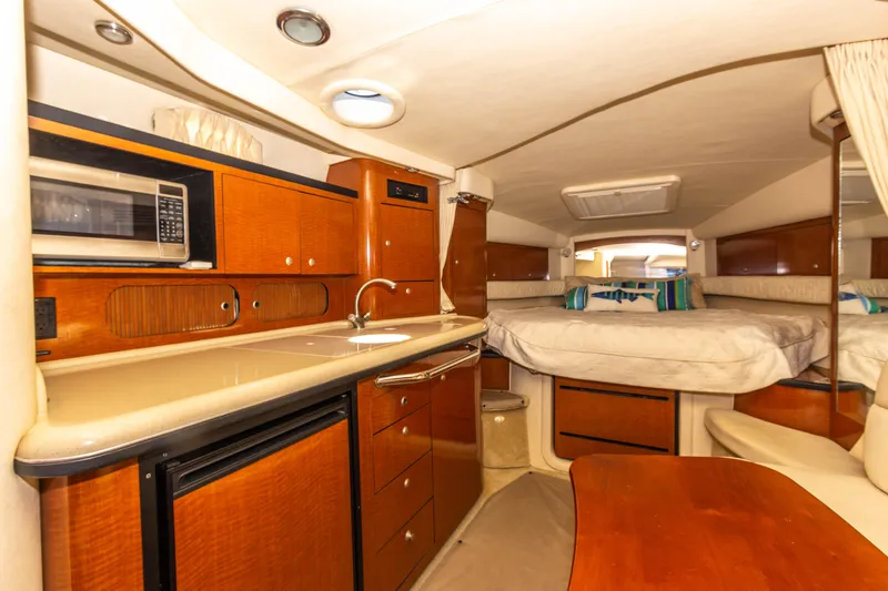 Slide: The Image of Interior of 2005 Sea Ray 340 Sundancer yacht with kitchenette and sleeping area. - 41