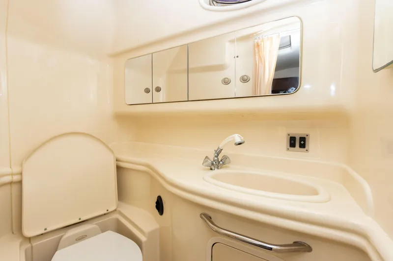 Slide: The Image of 2005 Sea Ray 340 Sundancer bathroom with sink, mirror, and toilet. - 43