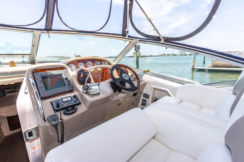 Slide: The Image of Helm of 2005 Sea Ray 340 Sundancer with modern navigation equipment and luxurious seating. - 47