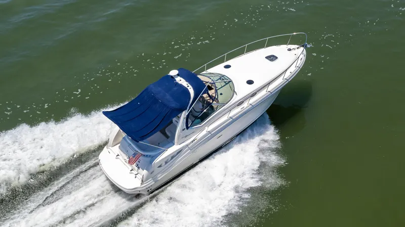 Slide: The Image of 2005 Sea Ray 340 Sundancer cruising on open water. - 5