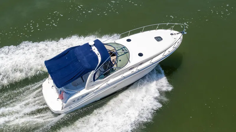 Slide: The Image of 2005 Sea Ray 340 Sundancer cruising on open water. - 6