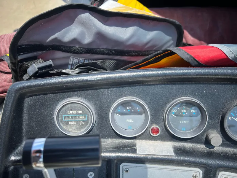 Slide: The Image of Dashboard of a 1987 Carver Voyager boat with gauges and controls. - 29