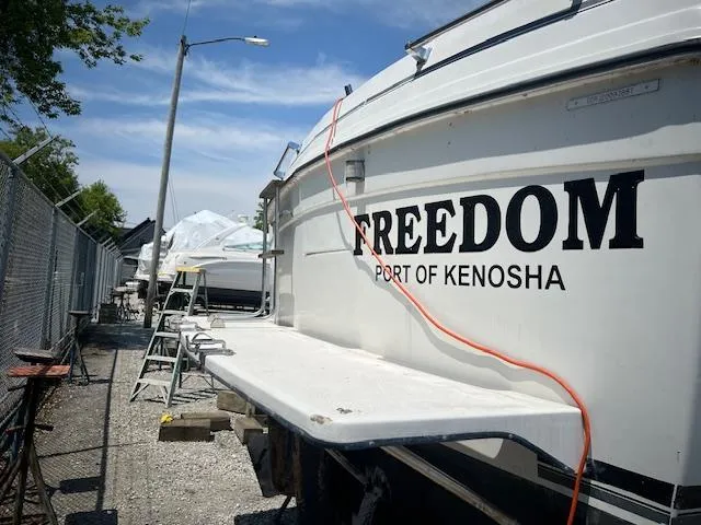 Slide: The Image of 1987 Carver Voyager boat named "Freedom" docked at Port of Kenosha. - 5