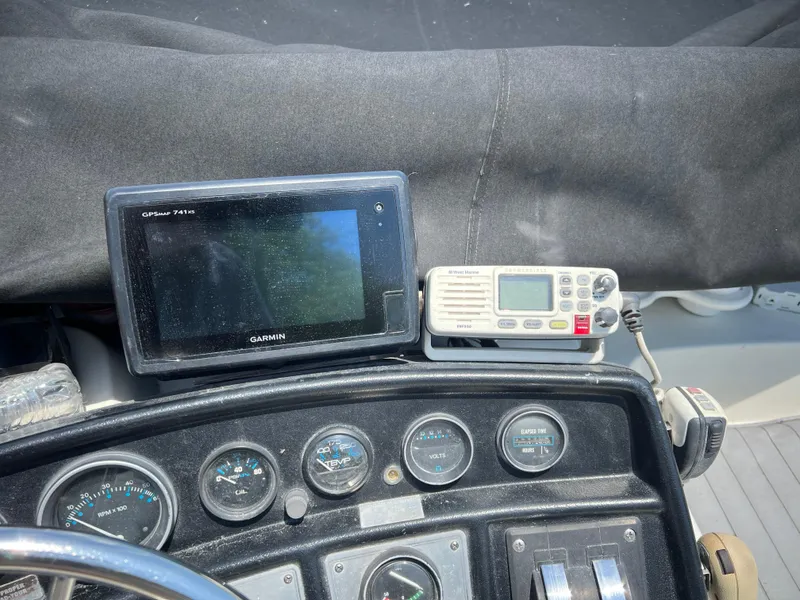 Slide: The Image of 1987 Carver Voyager dashboard with Garmin GPS and radio equipment. - 27