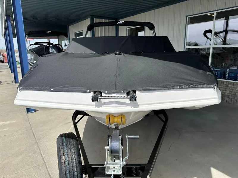 Slide: The Image of 2024 Starcraft SVX 210 OB DC boat on trailer with cover. - 2