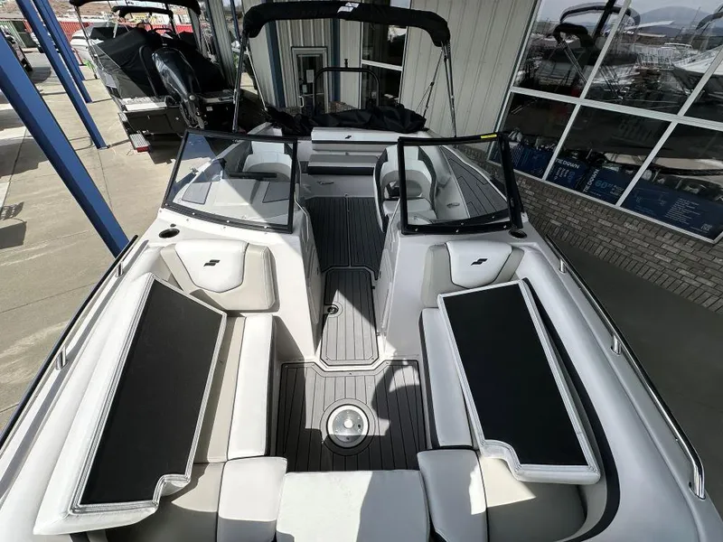 Slide: The Image of 2024 Starcraft SVX 210 OB DC boat interior with black and white seating. - 5