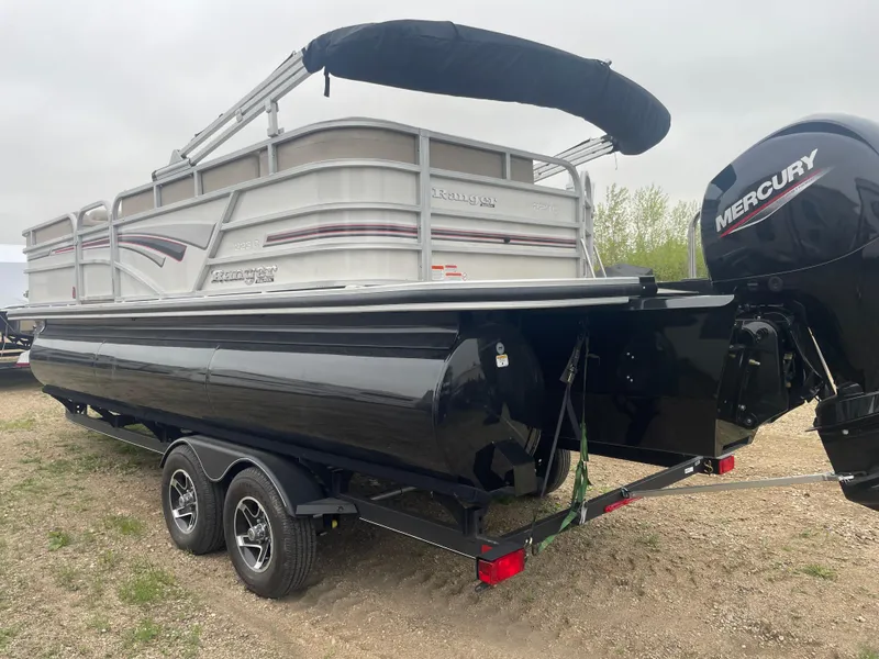 Slide: The Image of 2023 Ranger Reata 223C pontoon boat with Mercury outboard motor on trailer. - 3