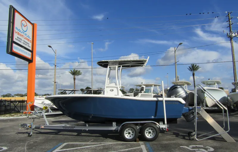 Slide: The Image of 2023 Tidewater 198 CC Adventure boat on trailer at dealership. - 0