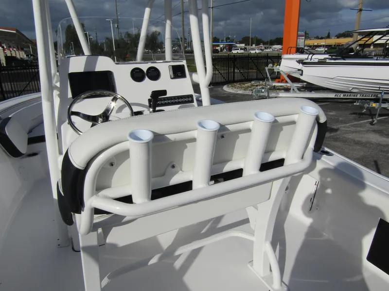 Slide: The Image of 2023 Tidewater 198 CC Adventure boat console with rod holders and steering wheel. - 24
