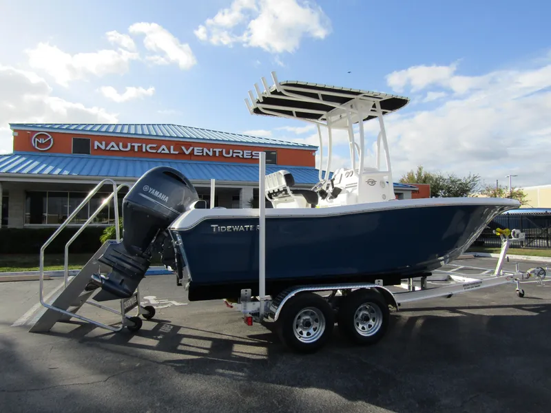 Slide: The Image of 2023 Tidewater 198 CC Adventure boat on trailer at Nautical Ventures dealership. - 3
