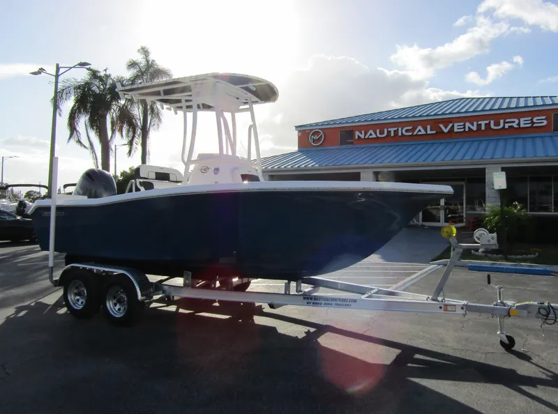 Slide: The Image of 2023 Tidewater 198 CC Adventure boat on trailer at Nautical Ventures dealership. - 5