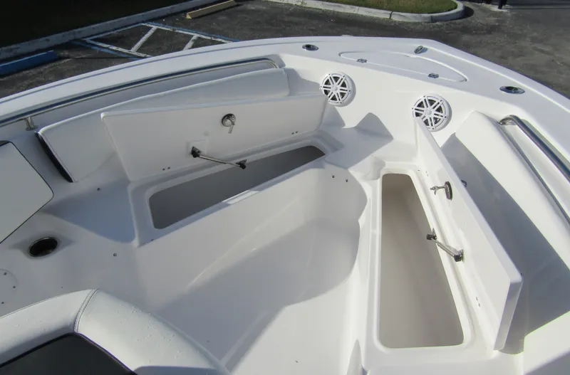 Slide: The Image of 2023 Tidewater 198 CC Adventure boat with open storage compartments and speakers. - 10