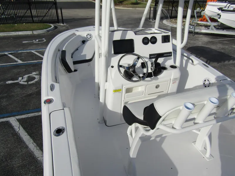 Slide: The Image of 2023 Tidewater 198 CC Adventure boat interior with console and seating. - 26