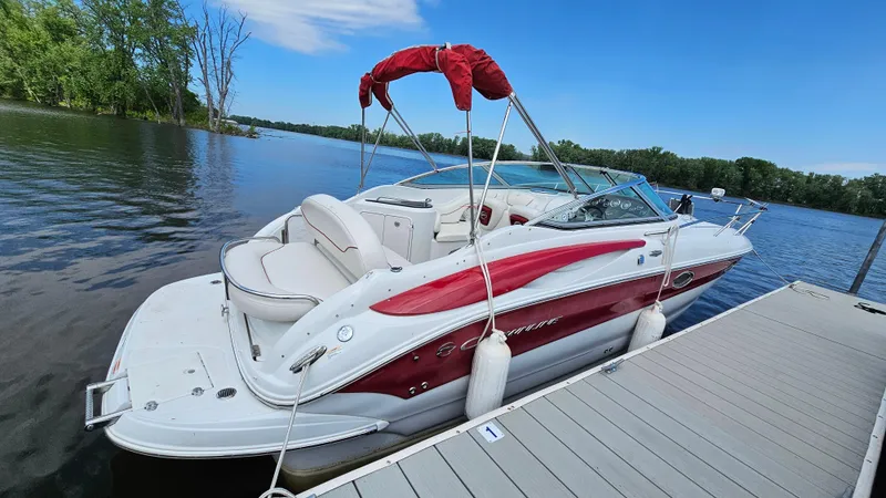 The Image of 2010 Crownline 260 CR boat docked on a serene lake. - 1