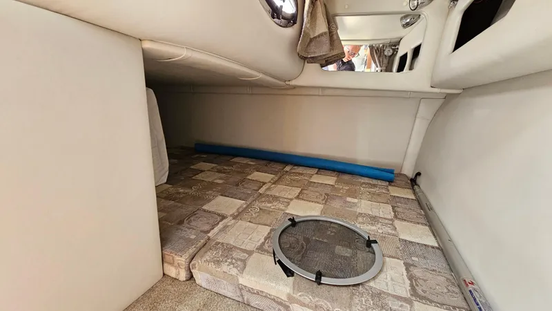 Slide: The Image of 2010 Crownline 260 CR cabin interior with patterned flooring. - 19