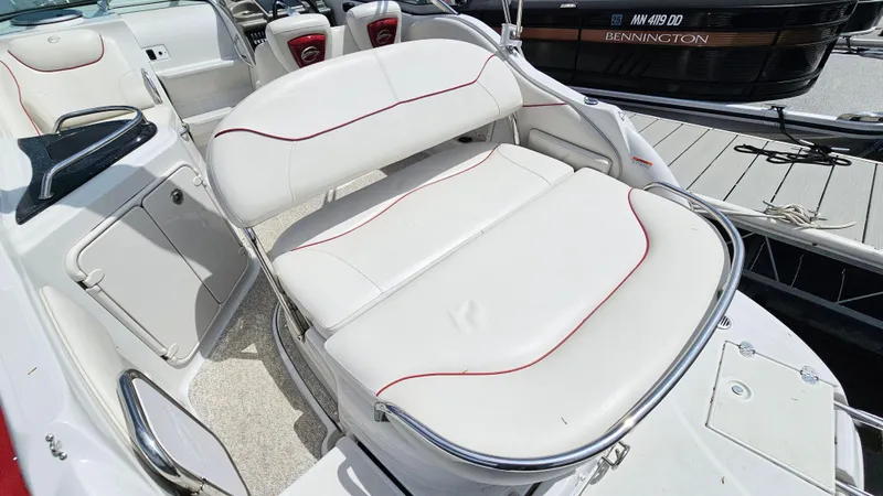 Slide: The Image of 2010 Crownline 260 CR boat interior with white leather seating. - 5