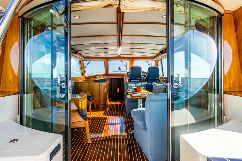 Slide: The Image of Luxurious interior of 2007 Hinckley Talaria 55 FB yacht with elegant wood and blue seating. - 11