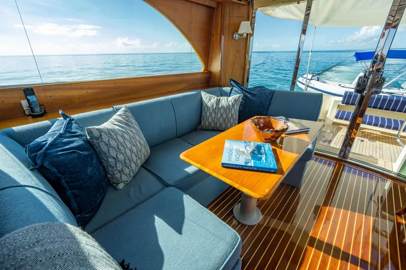 Slide: The Image of Luxurious 2007 Hinckley Talaria 55 FB yacht interior with ocean view and elegant seating area. - 13