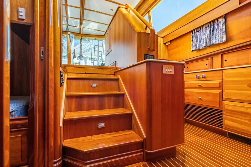 Slide: The Image of Interior of 2007 Hinckley Talaria 55 FB yacht with wooden stairs and cabinetry. - 18