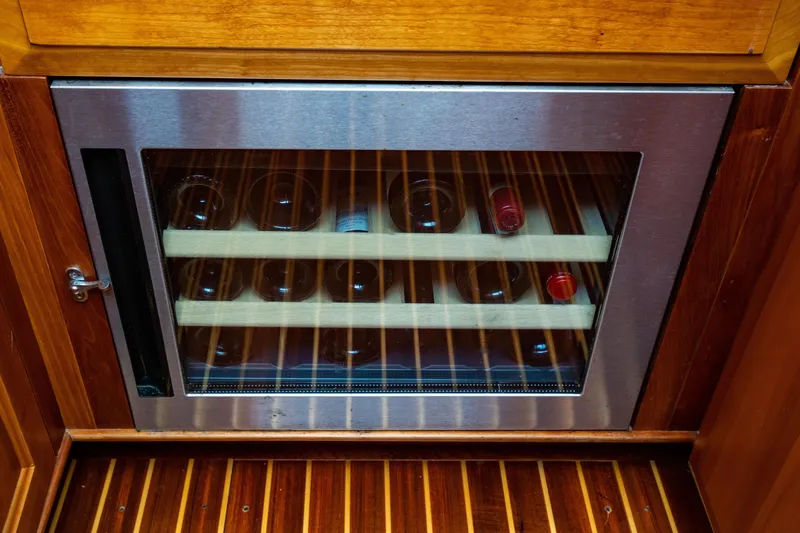 Slide: The Image of Wine cooler with wooden shelves in 2007 Hinckley Talaria 55 FB yacht interior. - 22