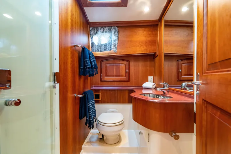 Slide: The Image of Luxurious 2007 Hinckley Talaria 55 FB yacht bathroom with wood accents and modern fixtures. - 26