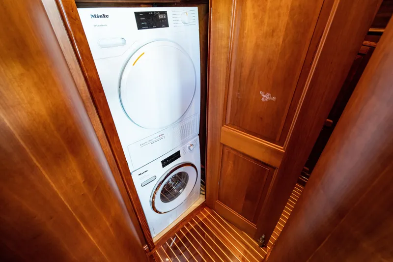 Slide: The Image of Laundry area with Miele appliances on 2007 Hinckley Talaria 55 FB yacht. - 29