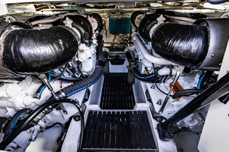 Slide: The Image of Engine room of 2007 Hinckley Talaria 55 FB yacht, showcasing dual engines and mechanical components. - 43