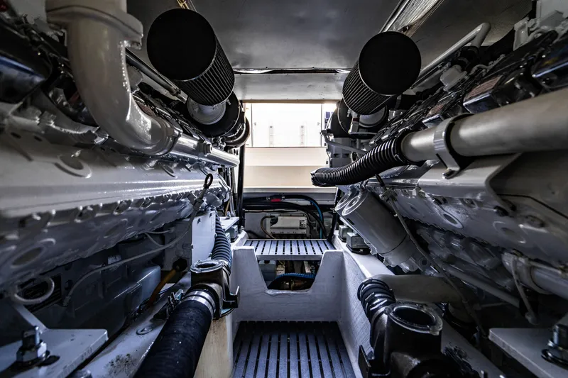 Slide: The Image of Engine room of 2007 Hinckley Talaria 55 FB yacht, showcasing dual engines and mechanical components. - 46