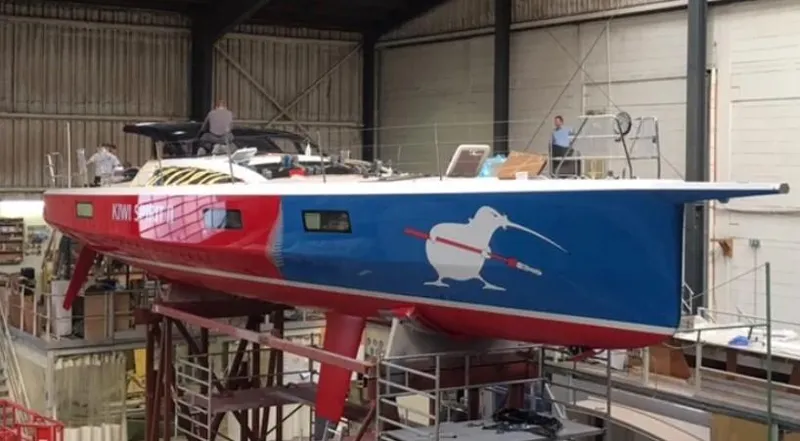 Slide: The Image of Knierim FC 53 yacht 2017 in a shipyard, featuring a colorful kiwi bird graphic. - 29