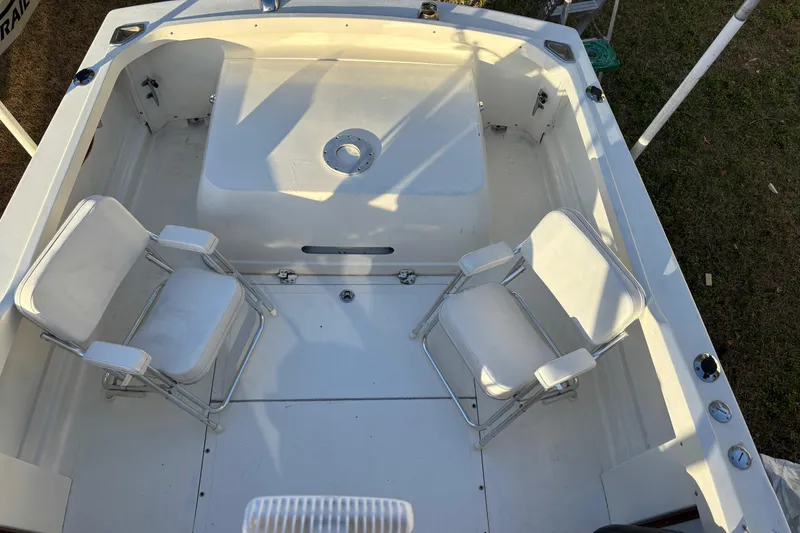 Slide: The Image of 1966 Bertram 25 boat interior with two white chairs. - 15