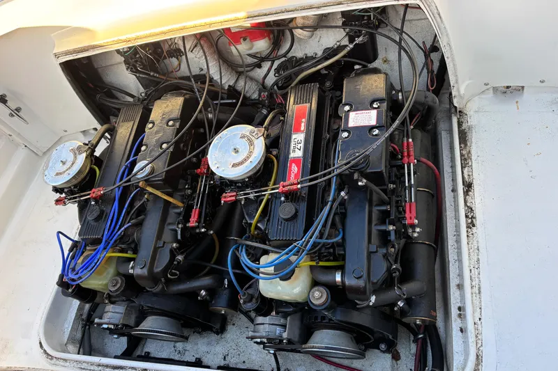 Slide: The Image of 1966 Bertram 25 engine compartment with dual inboard motors and wiring. - 17