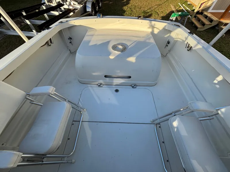 Slide: The Image of 1966 Bertram 25 boat interior with seating and storage compartments. - 4
