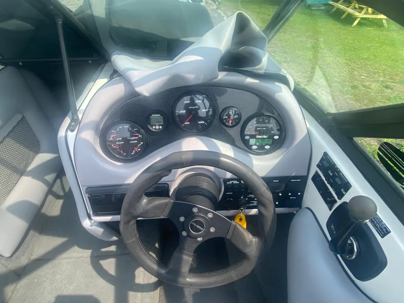 Slide: The Image of 2005 Calabria Cal-Air boat dashboard with steering wheel and gauges. - 10