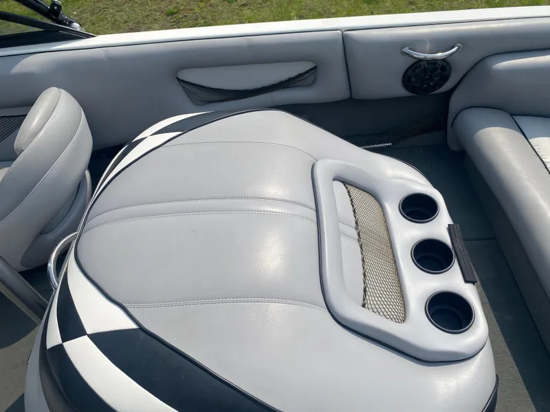 Slide: The Image of 2005 Calabria Cal-Air boat interior with cup holders and cushioned seating. - 17