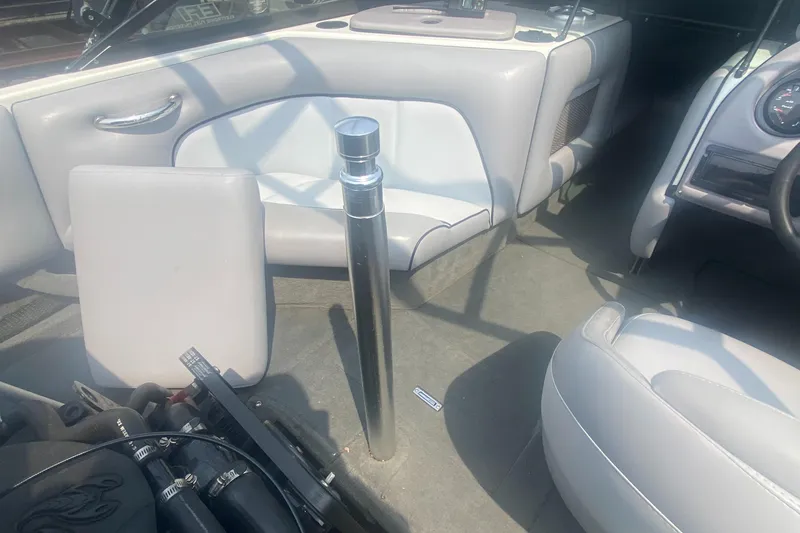 Slide: The Image of Interior of a 2005 Calabria Cal-Air boat with white seating and chrome details. - 18