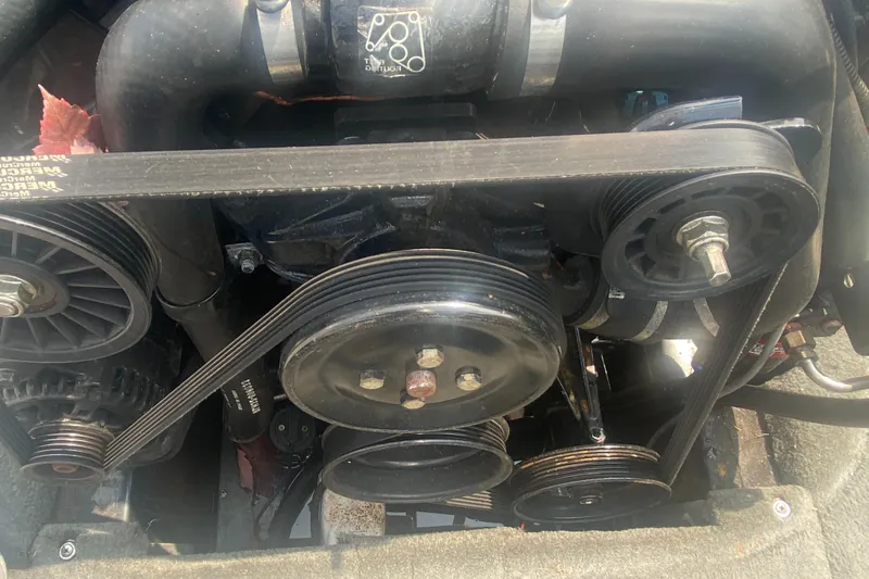 Slide: The Image of Close-up of a 2005 Calabria Cal-Air engine with visible belts and pulleys. - 19