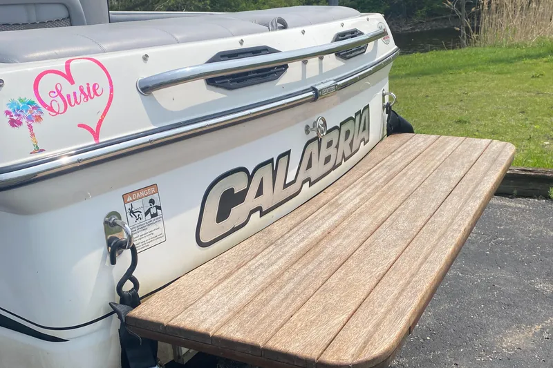 Slide: The Image of 2005 Calabria Cal-Air boat with wooden swim platform and custom Susie decal. - 4