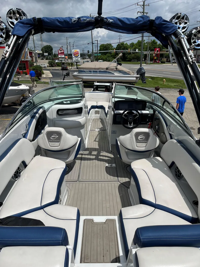 Slide: The Image of 2023 Crownline 270 SS SURF boat interior with white and blue seating. - 1
