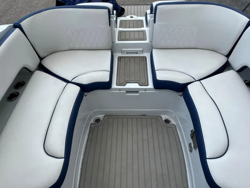 Slide: The Image of 2023 Crownline 270 SS SURF boat interior with white and blue seating. - 12