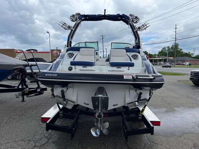 Slide: The Image of 2023 Crownline 270 SS SURF boat on a trailer, rear view. - 17