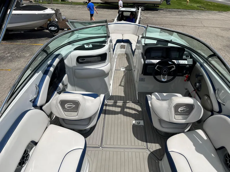 Slide: The Image of 2023 Crownline 270 SS SURF boat interior with luxurious seating and modern dashboard. - 2