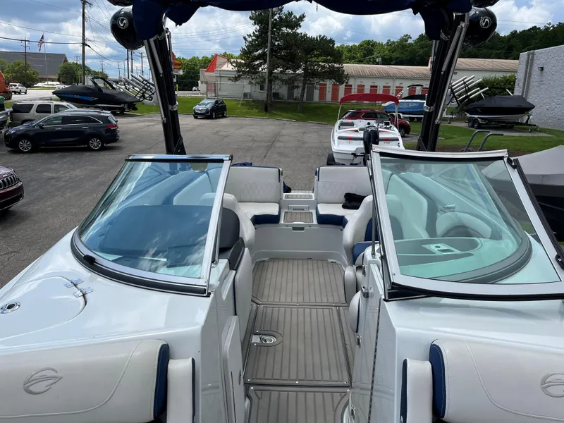 Slide: The Image of 2023 Crownline 270 SS SURF boat interior with open windshield and seating area. - 5