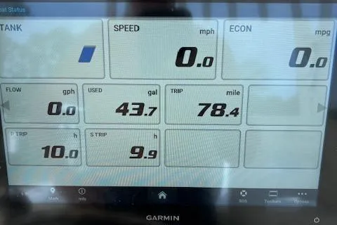 Slide: The Image of Garmin display on 2024 Cobia 301 Center Console showing speed, fuel, and trip data. - 7
