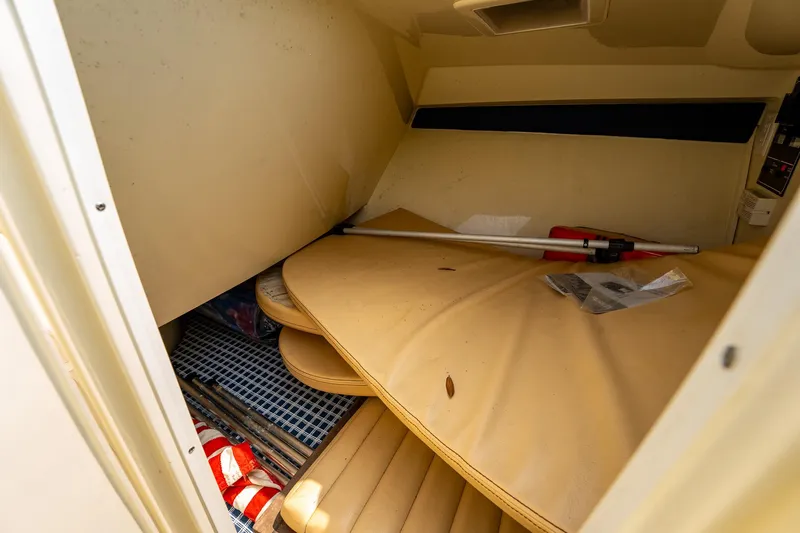 Slide: The Image of 2013 Chris-Craft Launch 32 cabin interior with storage items and cushions. - 17