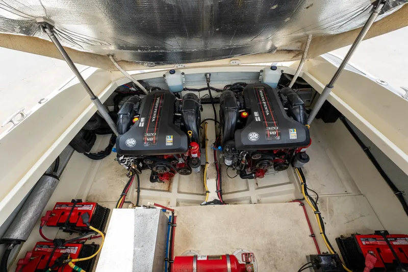 Slide: The Image of 2013 Chris-Craft Launch 32 engine compartment with twin engines and battery setup. - 18