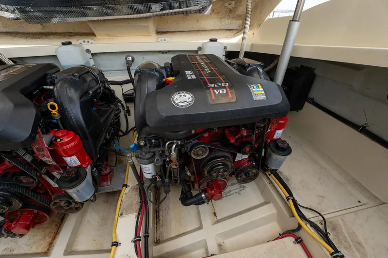 Slide: The Image of 2013 Chris-Craft Launch 32 engine compartment with dual V8 engines. - 21